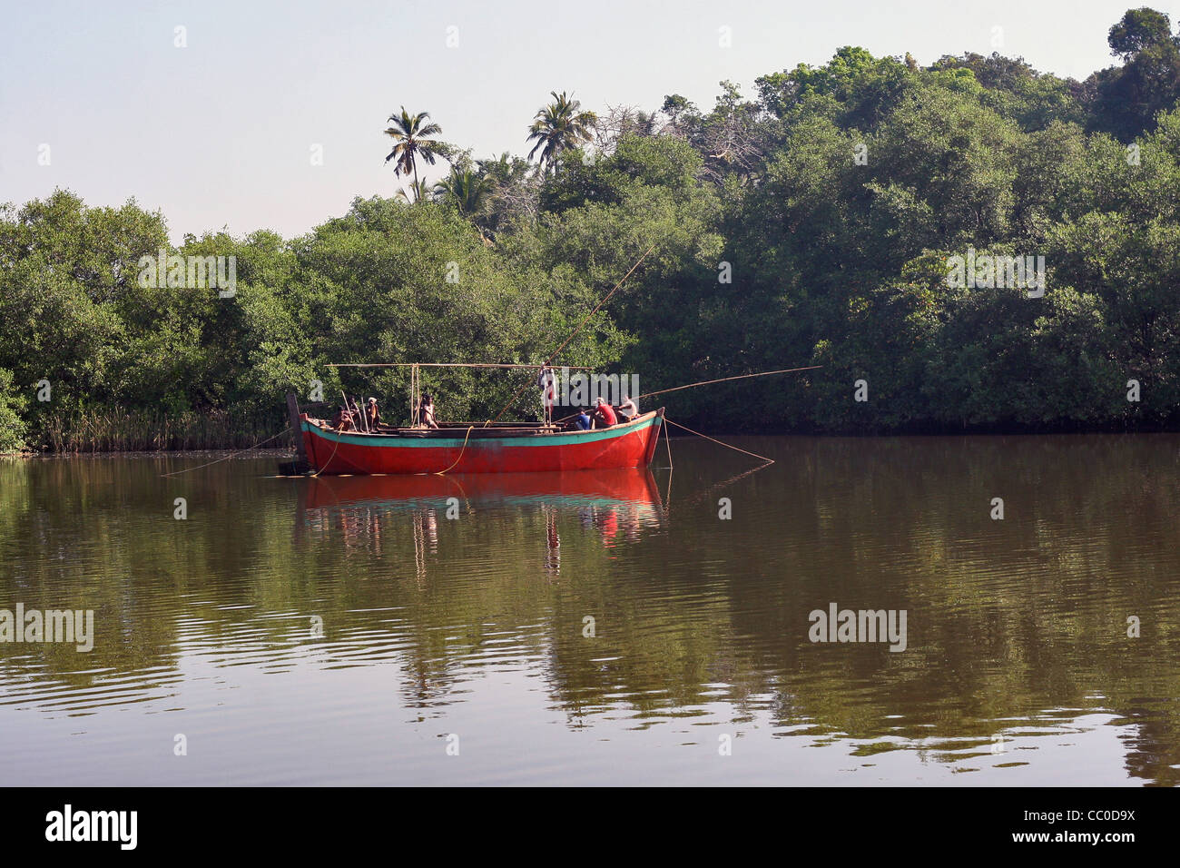 Mangrove forest and sand mining boat Stock Photo