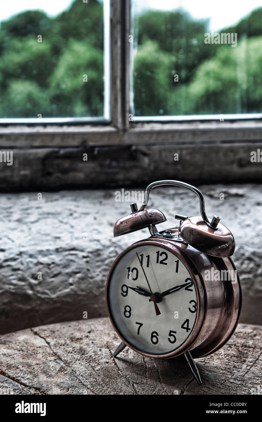 Vintage metal alarm clock by the window Stock Photo Alamy
