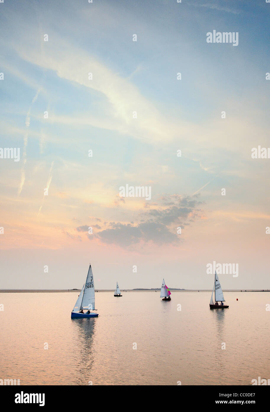 Sailing boats on the marine lake at West Kirby, Wirral on a still evening Stock Photo