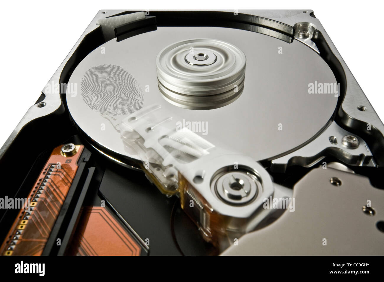 symbolic security theme showing a opened hard disk at work with big fingerprint Stock Photo
