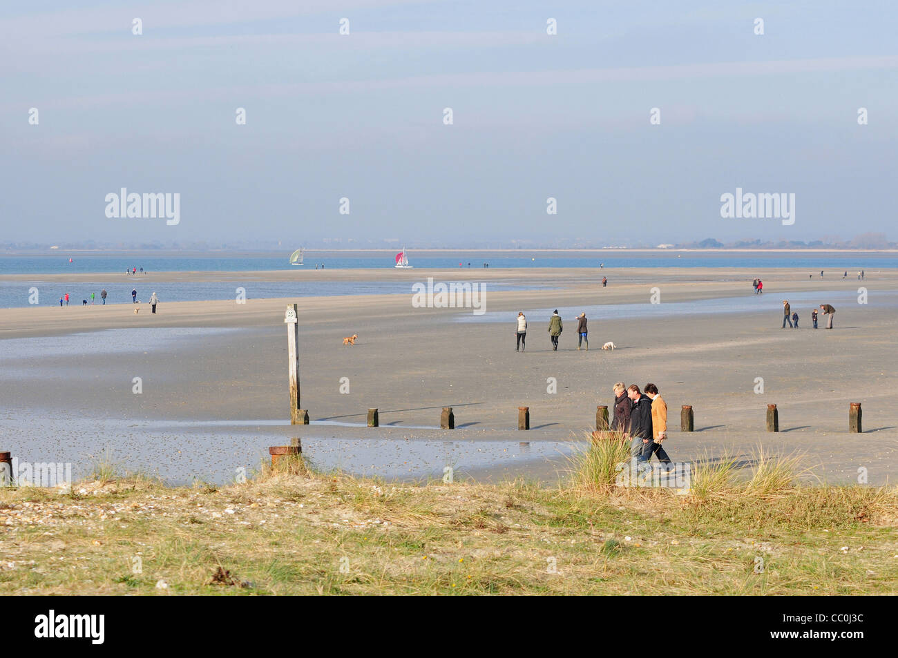 People walking at East Head West Wittering Stock Photo Alamy