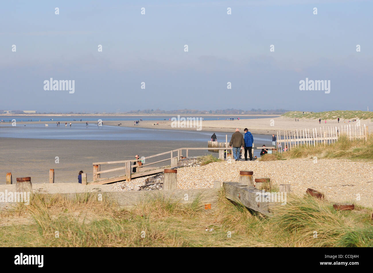 People walking at East Head Stock Photo Alamy
