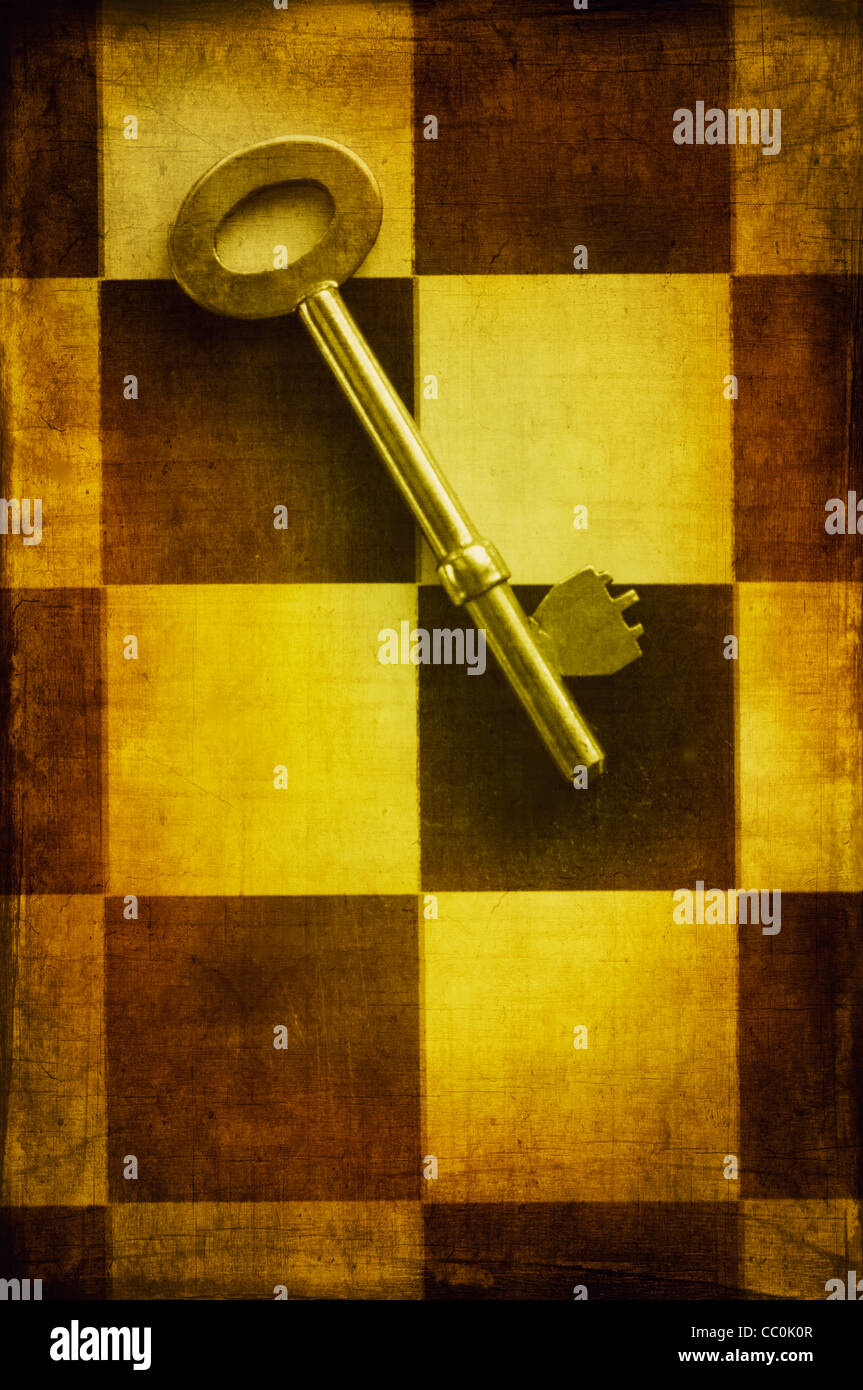 Old key over a chess board Stock Photo Alamy