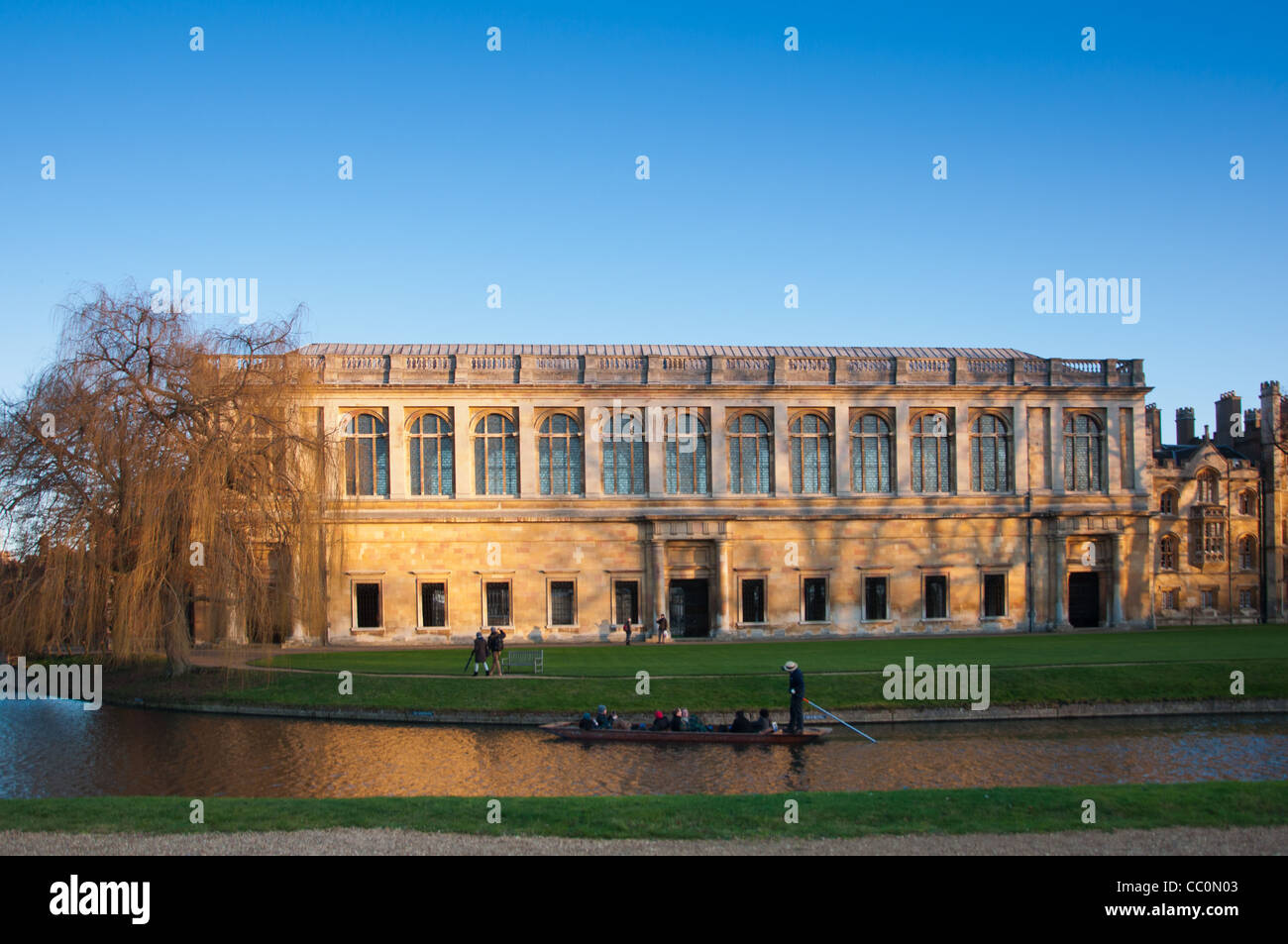 The Wren Library at sunset, Trinity College Cambridge, with punting in front on the river Cam, UK Stock Photo
