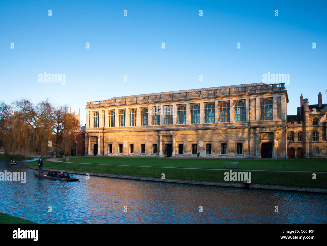 The Wren Library at sunset, Trinity College Cambridge, with punting in front on the river Cam, UK Stock Photo