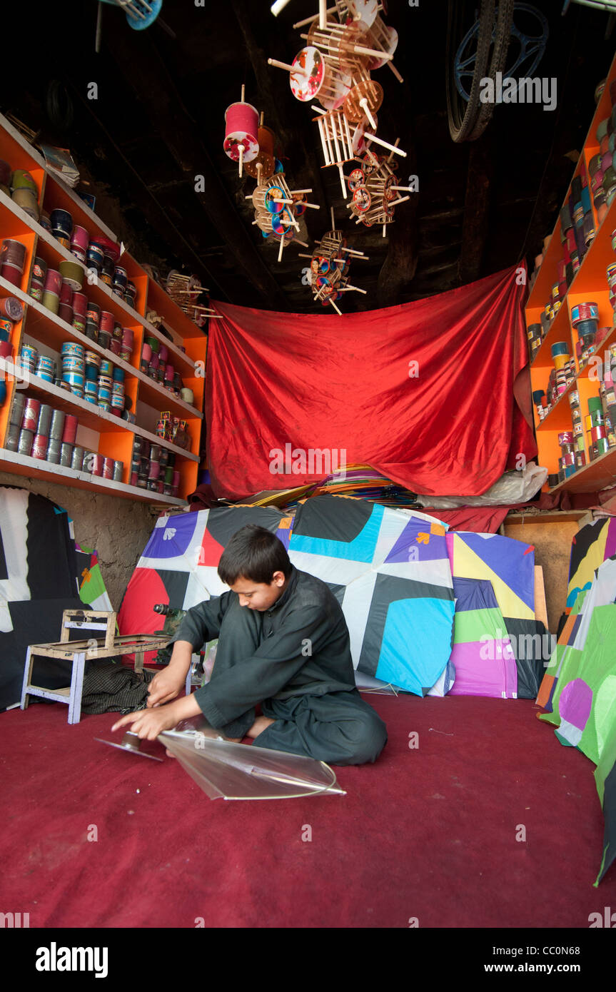 10 year old Jamil makes kites in his father's shop Stock Photo Alamy
