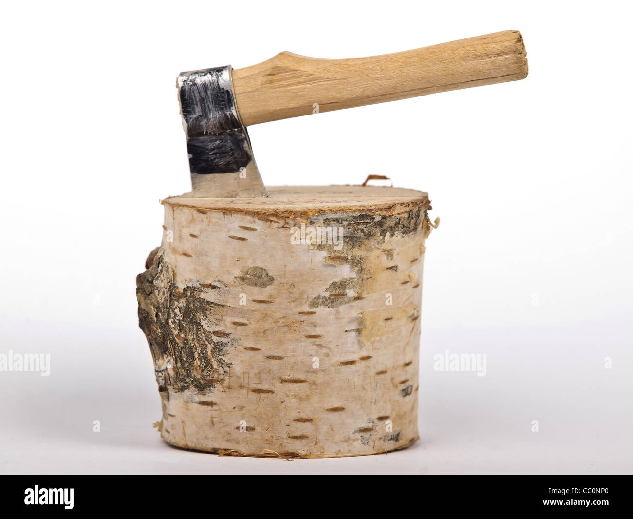 ax with handle stack in the chopped wood Stock Photo