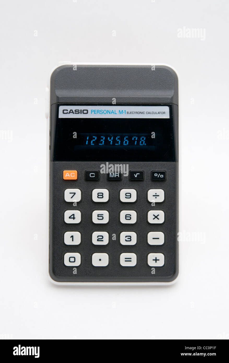 A an old casio calculator with a green LED display photographed against a white background Stock Photo