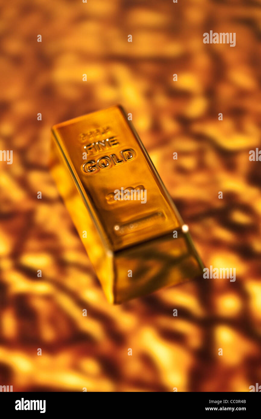 Fine Gold Bar on a molten gold background Stock Photo Alamy