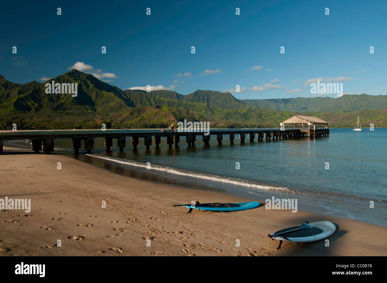 Lone paddle boards on the beach at Hanalei Bay, Kauai, Hawaii Stock