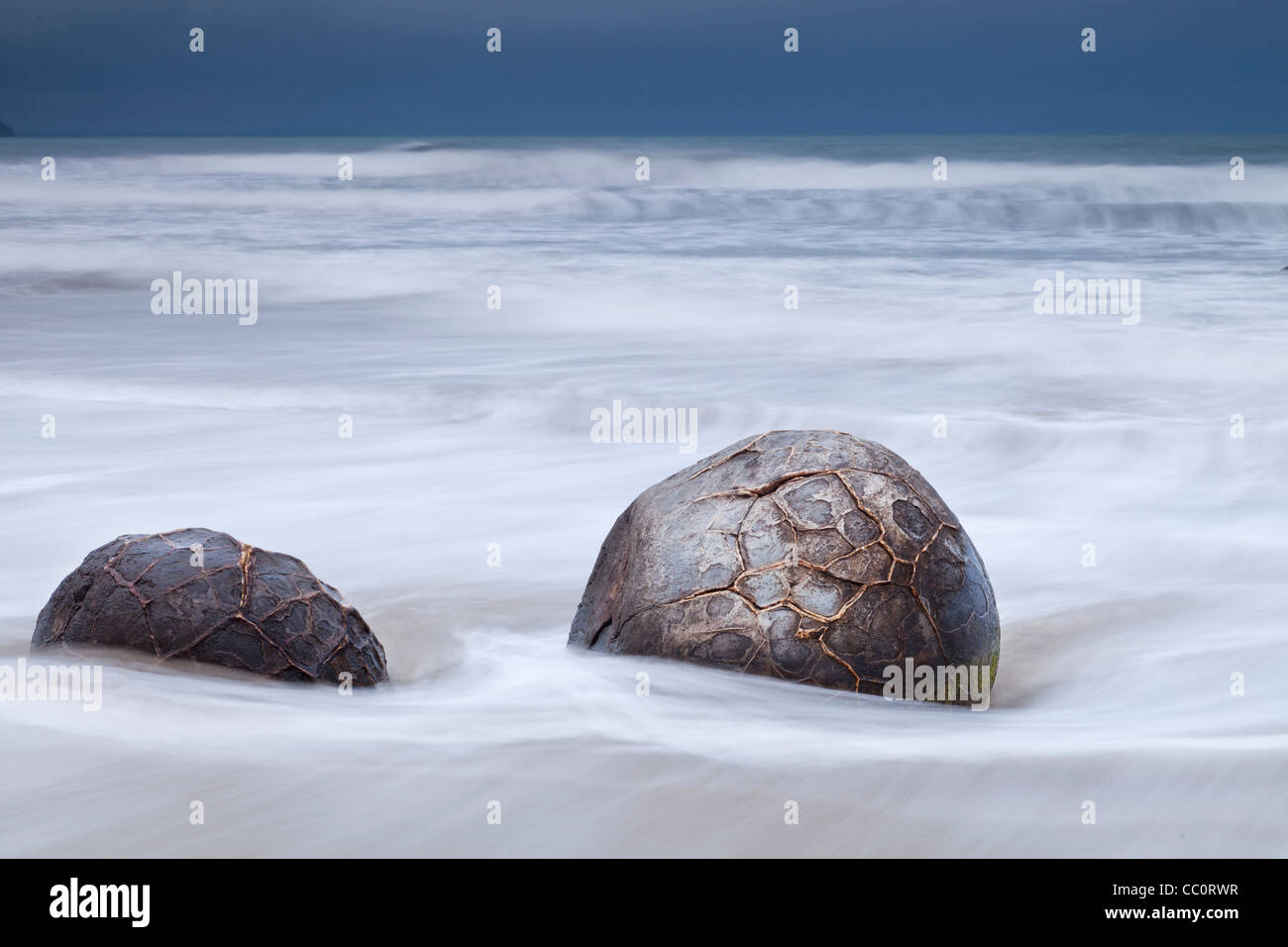 Boulders, Moeraki, Otago, New Zealand, at nightfall, long exposure. Stock Photo