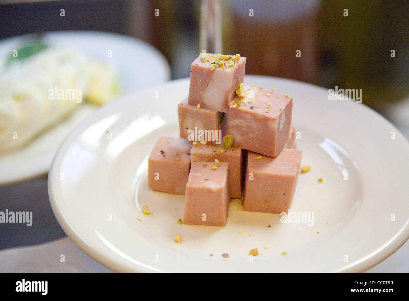 Mortadella cubes on a plate Stock Photo Alamy