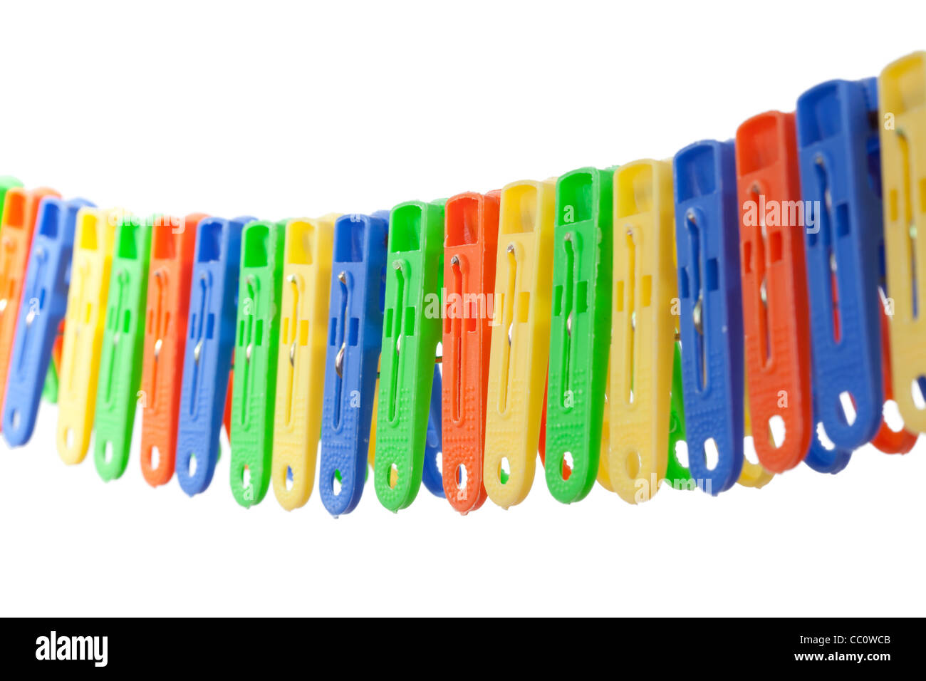 Colorful row of clothes pegs hang on clothesline Stock Photo