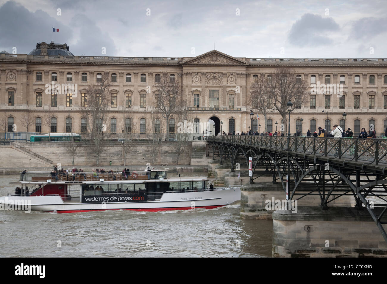 Louvre Art Museum and the Pont des Arts Bridge in Paris, France Stock ...