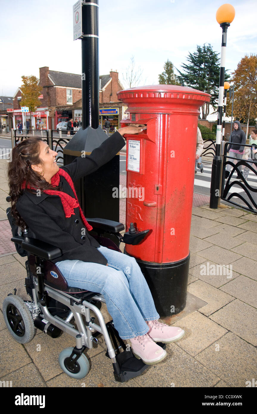 Woman posting letter in post hi-res stock photography and images - Alamy