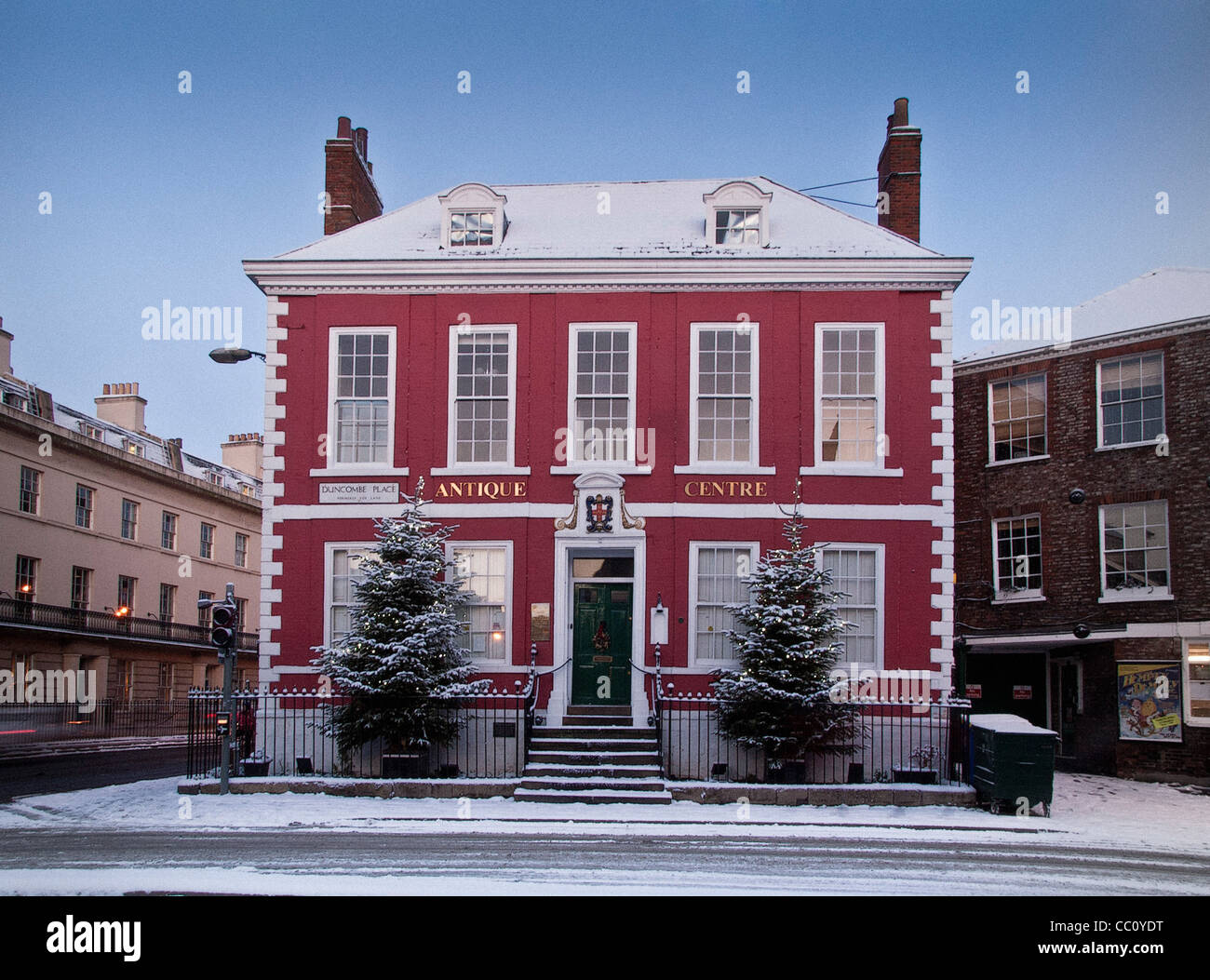 Red House Antique centre in snow with Christmas trees Stock Photo
