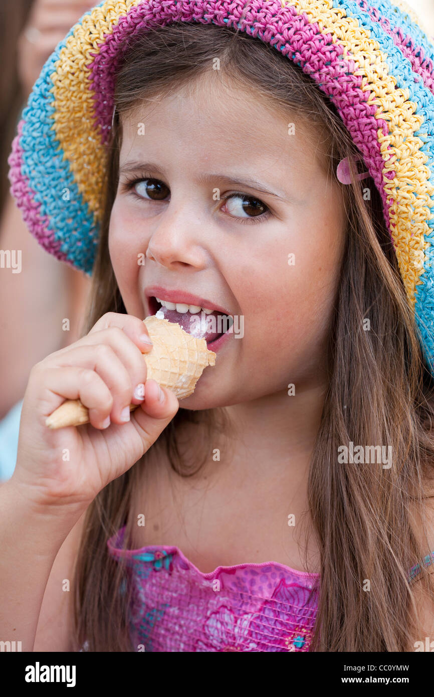 Girl eating ice cream Stock Photo - Alamy