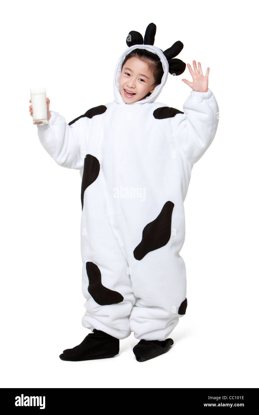 Cute girl in a cow costume with a glass of milk Stock Photo Alamy
