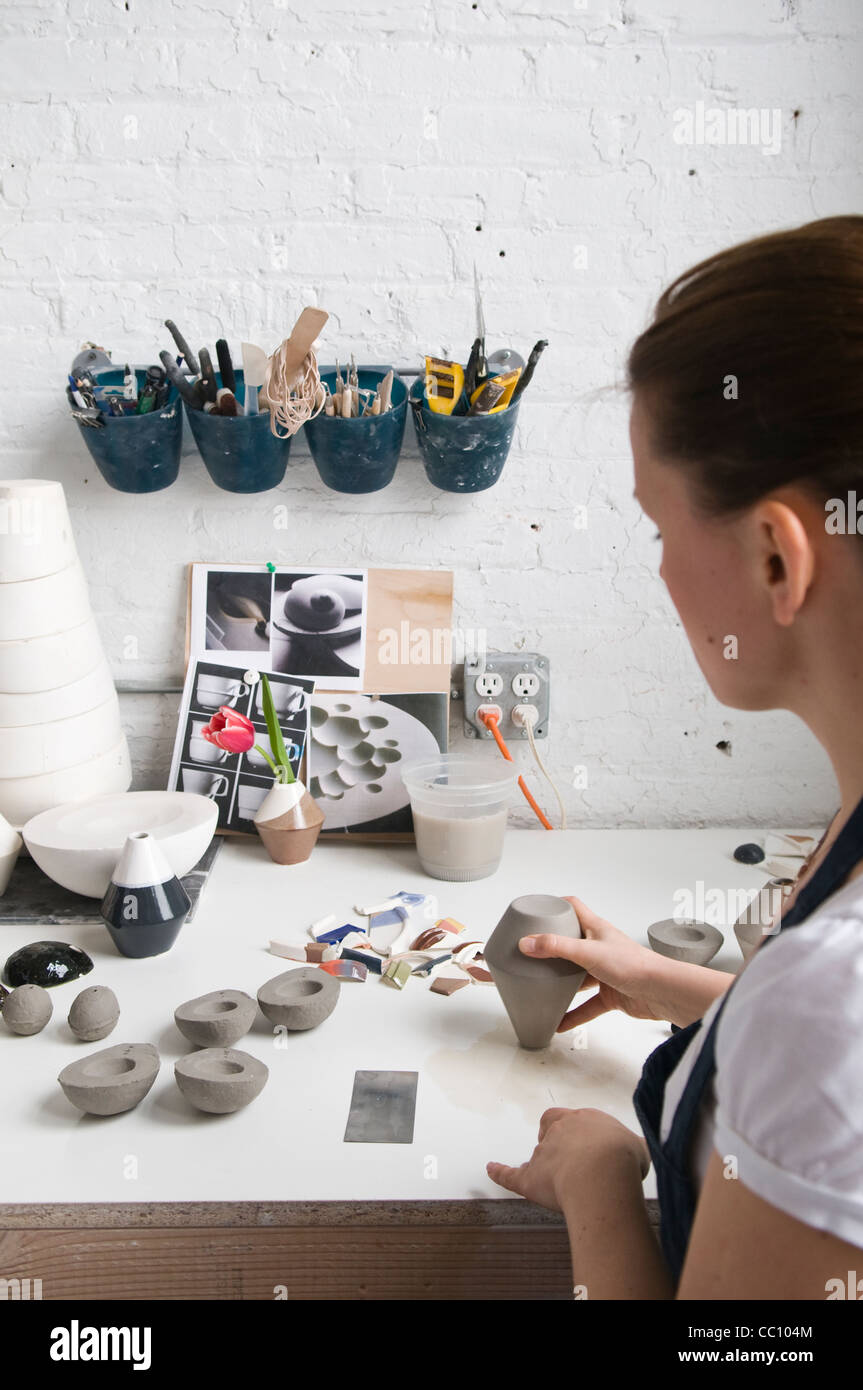 Ceramic artist at work in studio Stock Photo - Alamy