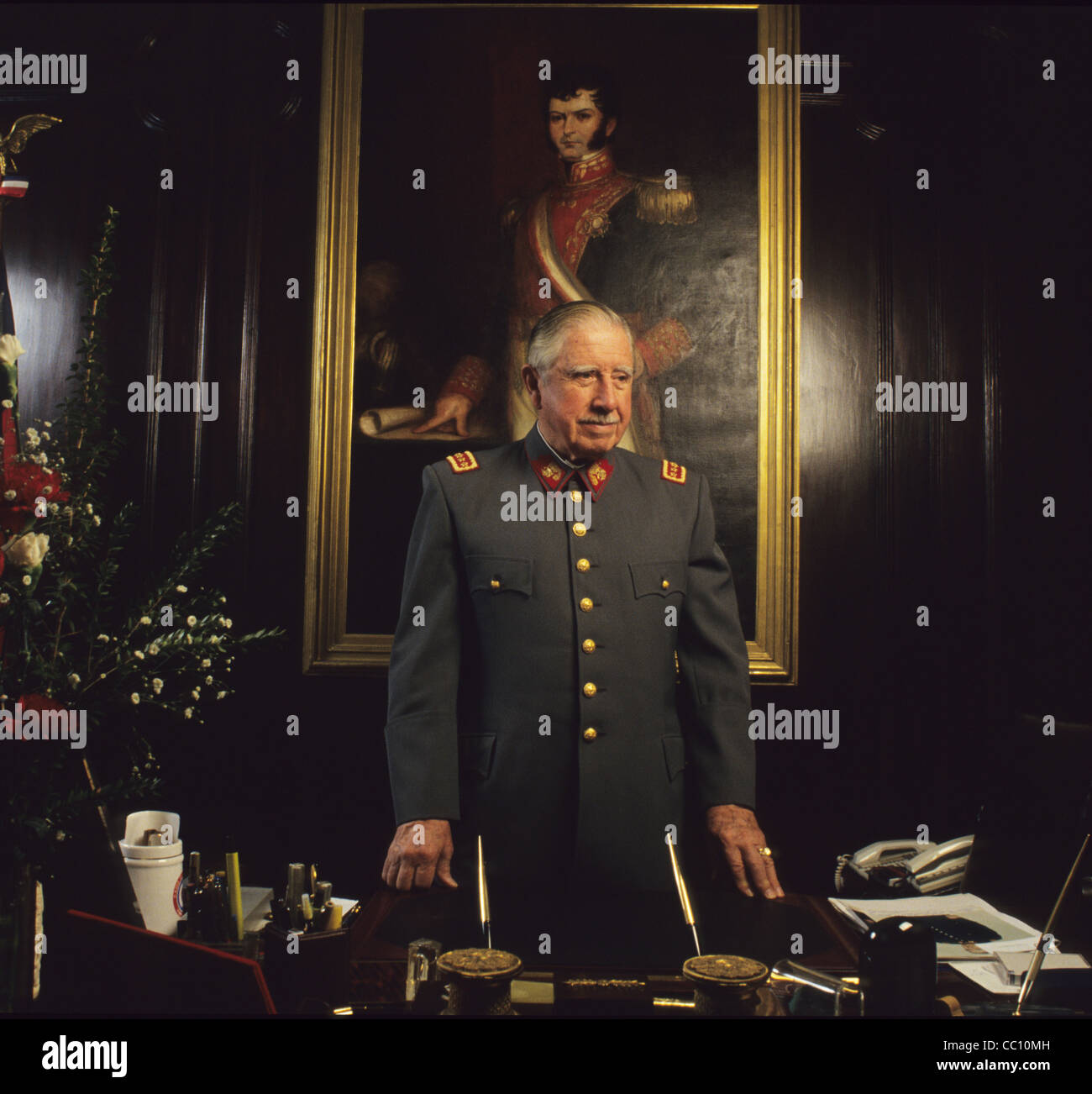 General Augusto Pinochet, Chile with General O^Higgins painting on the background Stock Photo