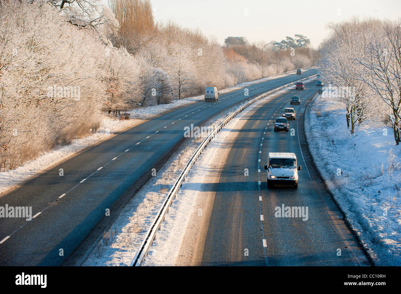 Cars travelling on snow cleared dual carriageway of the A64 in York, UK Stock Photo
