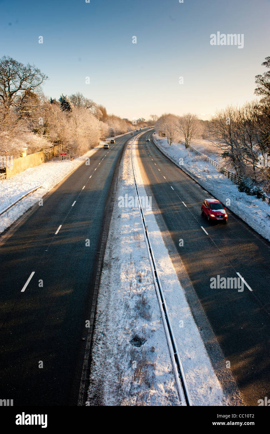 Cars travelling on snow cleared dual carriageway of the A64 in York, UK Stock Photo
