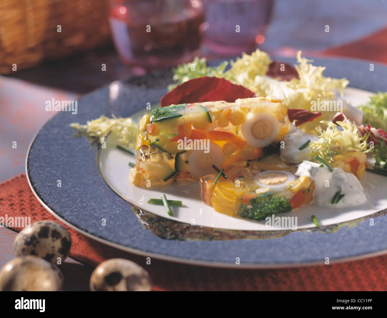 Vegetable terrine with quail eggs and herbal cream Stock Photo Alamy