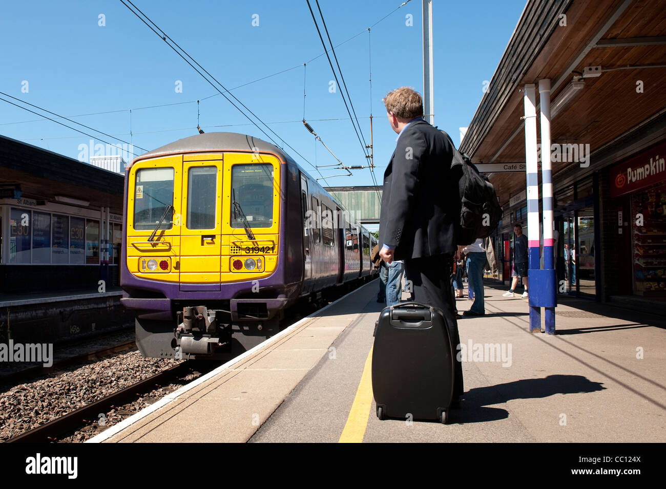 Passenger train in First Capital Connect livery pulling into a railway station in England. Stock Photo