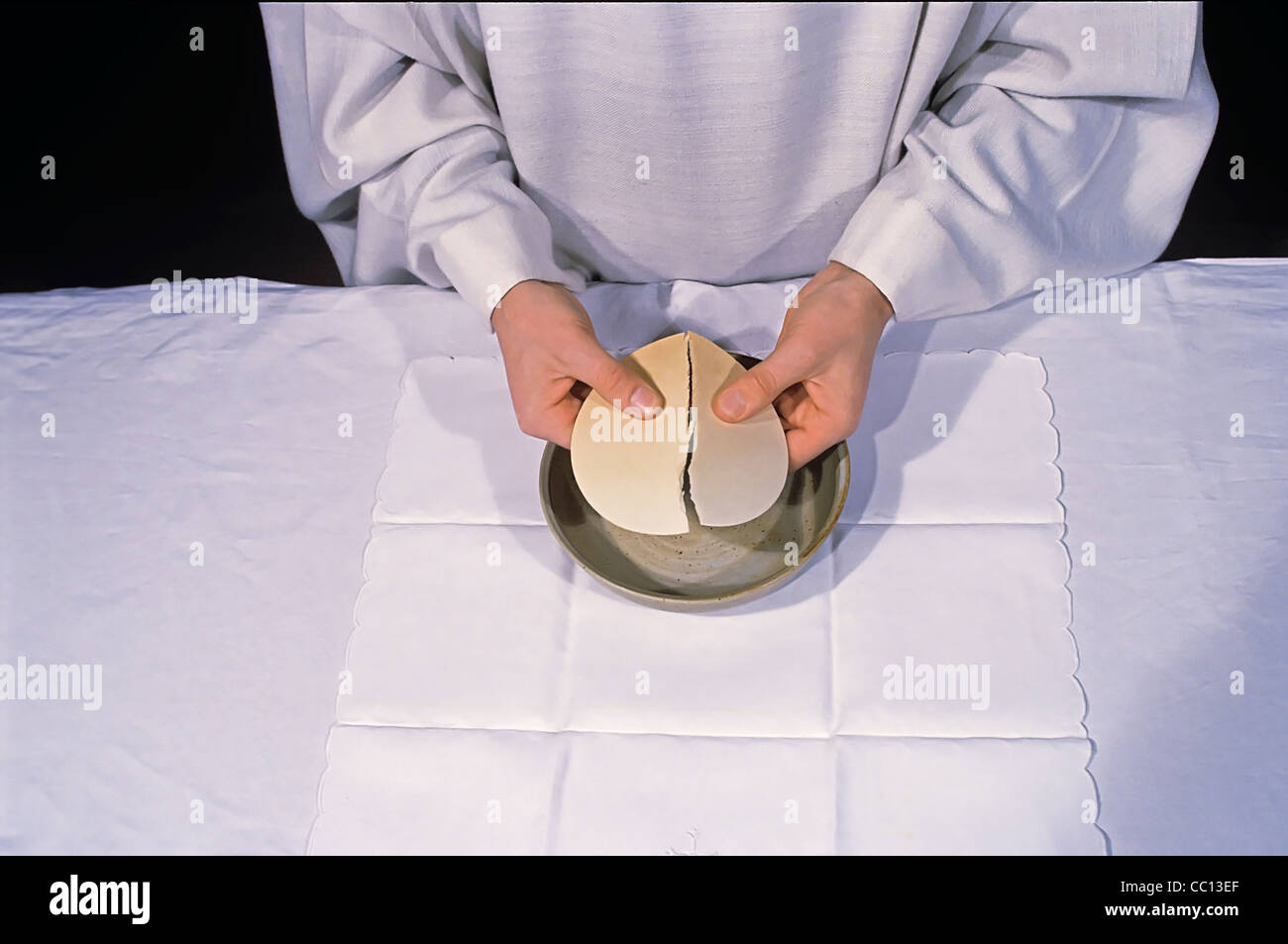 Breaking The Eucharistic Bread Stock Photo