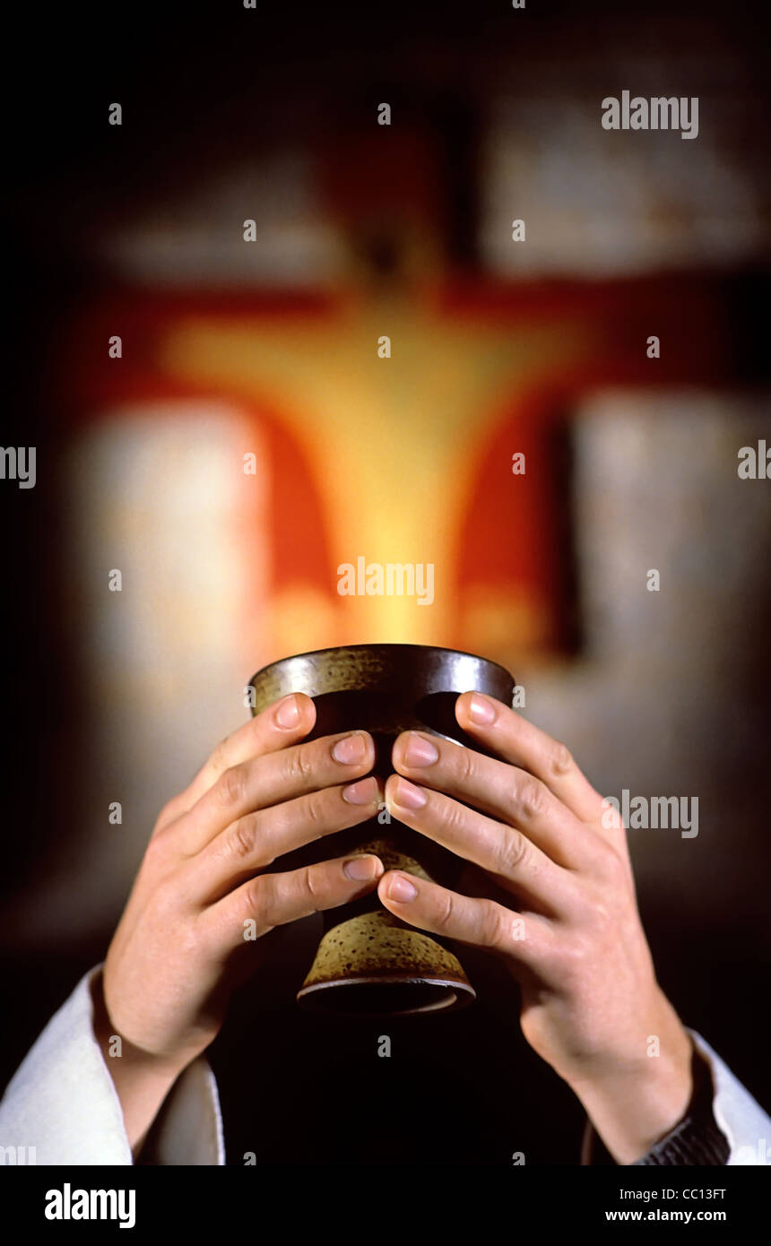 Consecration of the Chalice – christian Eucharist or Mass Stock Photo