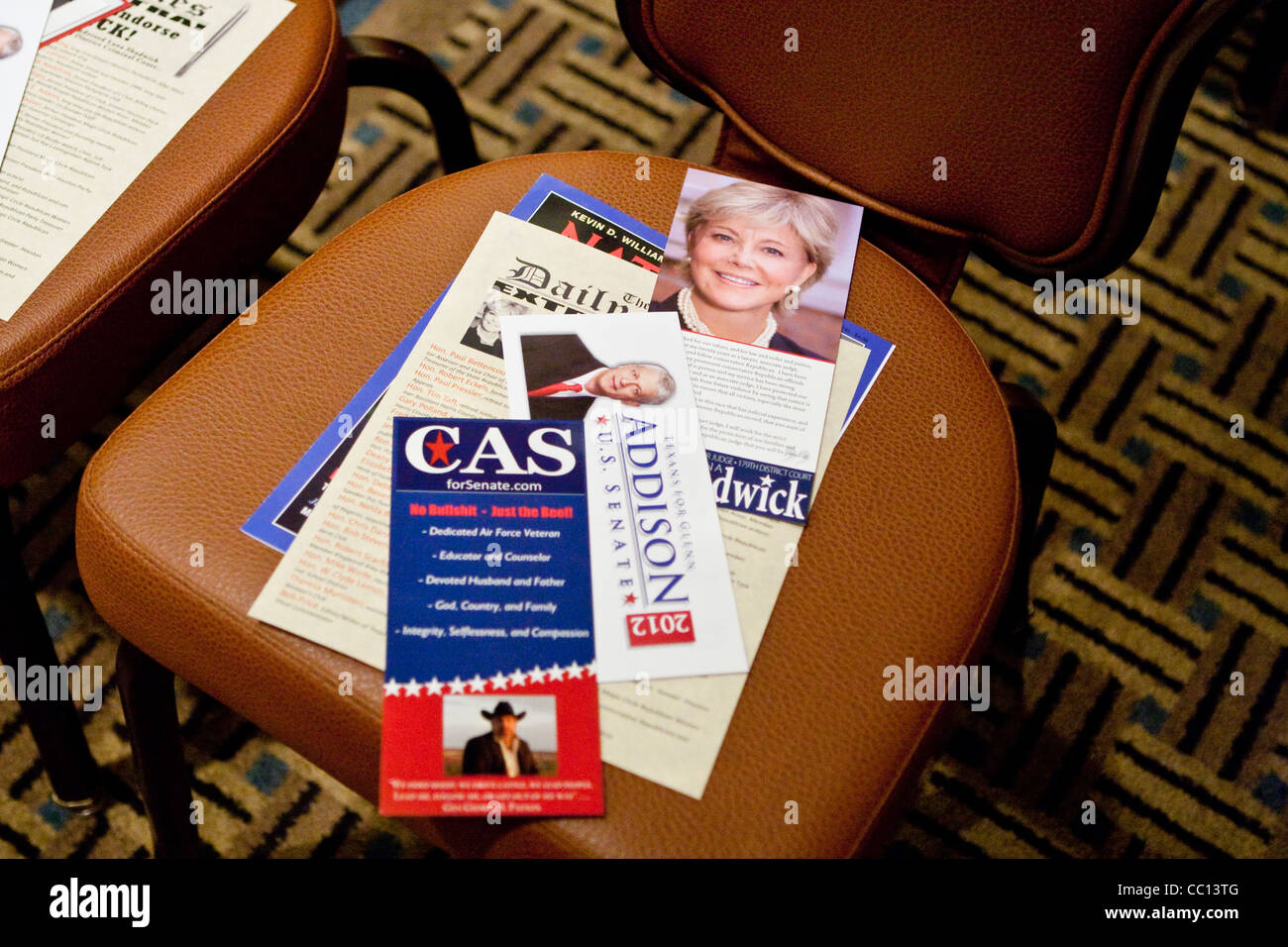 Flyers for several political candidates for United States Senate seat are placed on chair before debate in Houston, Texas Stock Photo