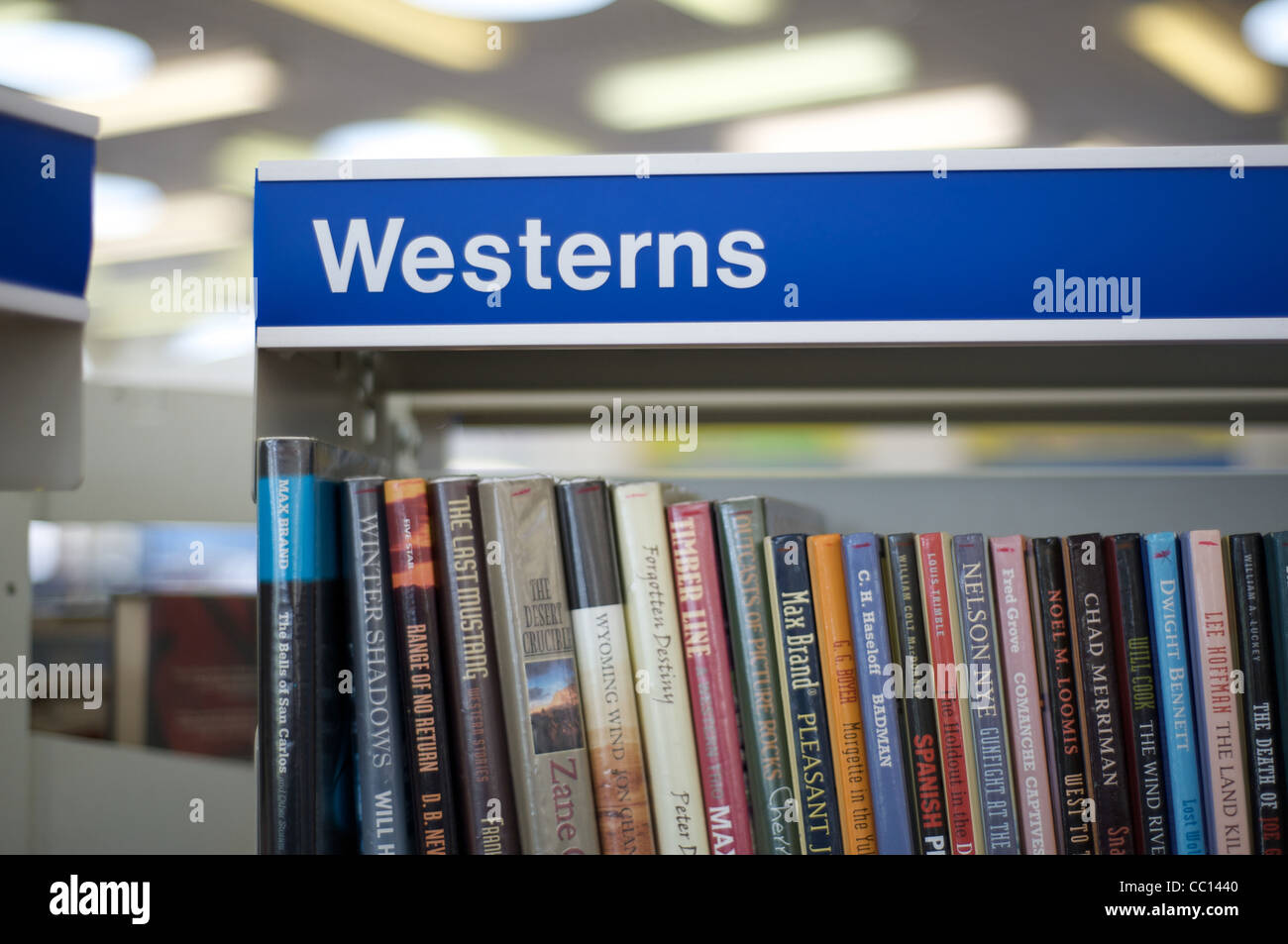 Library shelving sign westerns Stock Photo