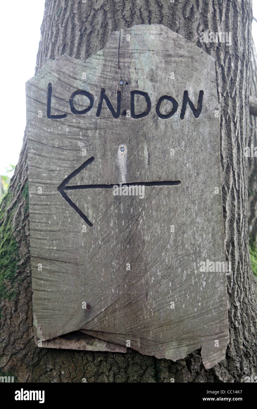 Direction indicator to London carved in wood. Stock Photo