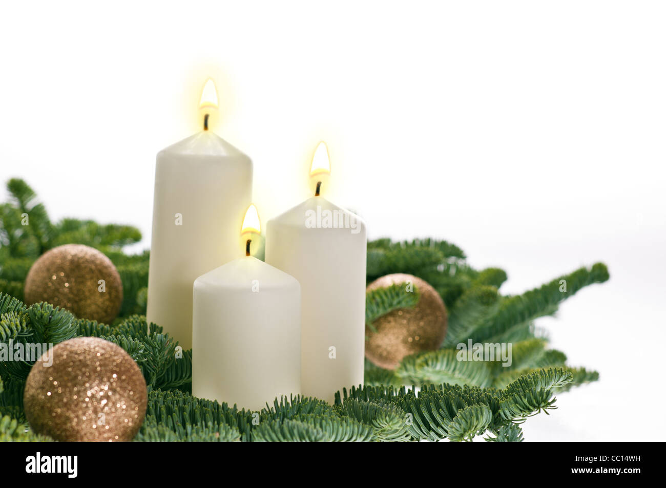 Two candles in advent setting with real Christmas tree branches Stock Photo