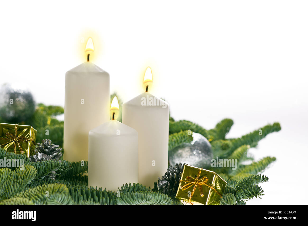 Two candles in advent setting with real Christmas tree branches Stock Photo