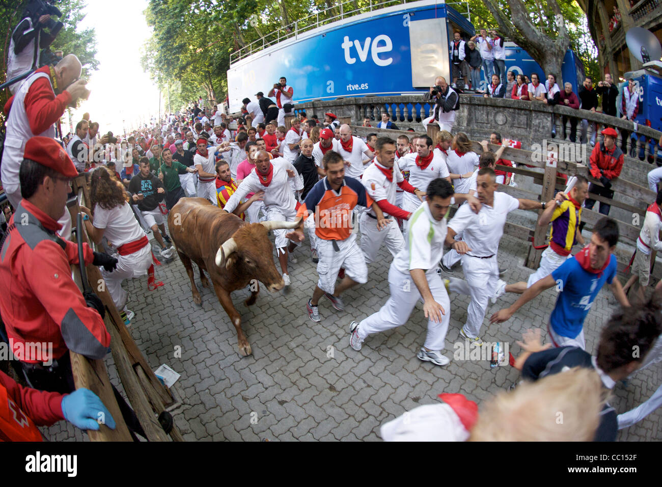 Crowds running with bulls during the annual festival of San Fermin (aka