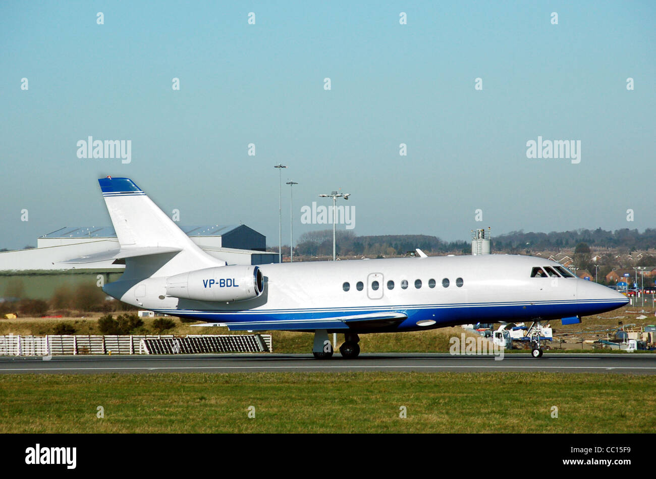 Dassault Falcon 2000 (Bermuda registration VP-BDL) takes off from London Luton Airport, England. Stock Photo