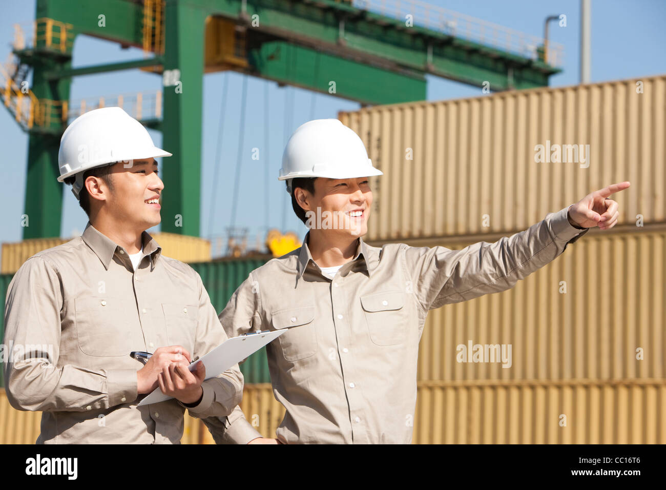 Male shipping industry workers at work Stock Photo Alamy