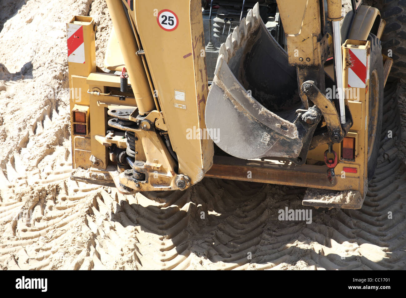 Yellow excavator on the construction site Stock Photo - Alamy