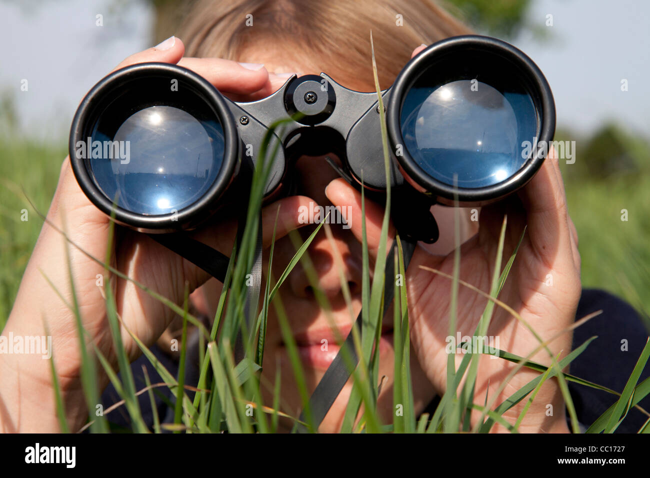 Looking through binoculars Stock Photo Alamy