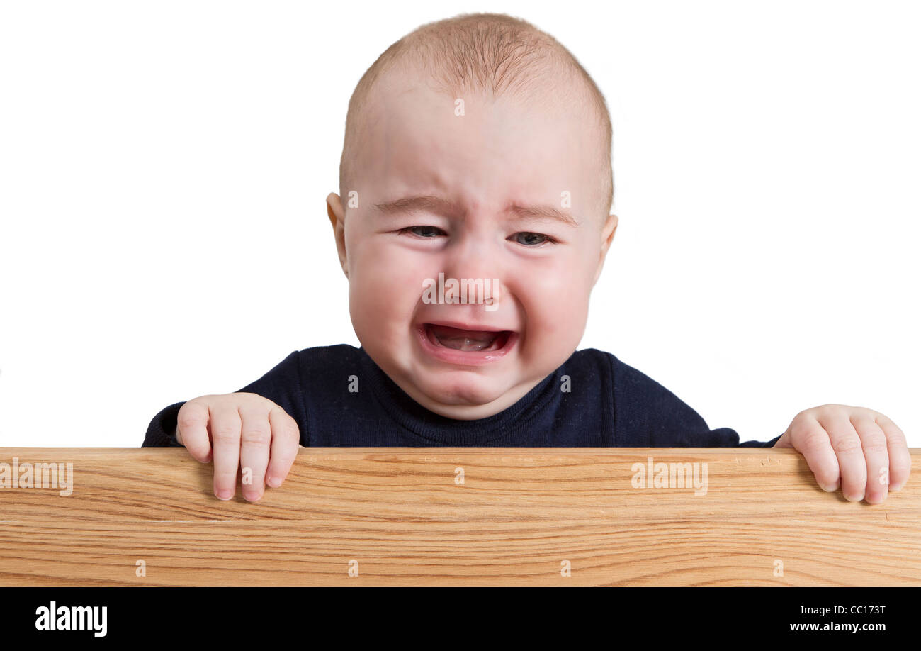 crying young child holding board. isolate on white background Stock Photo