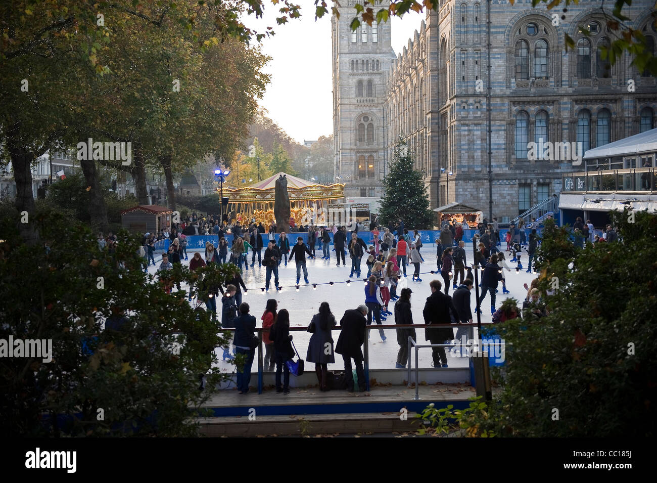 People skating on an ice rink outside the Natural History Museum