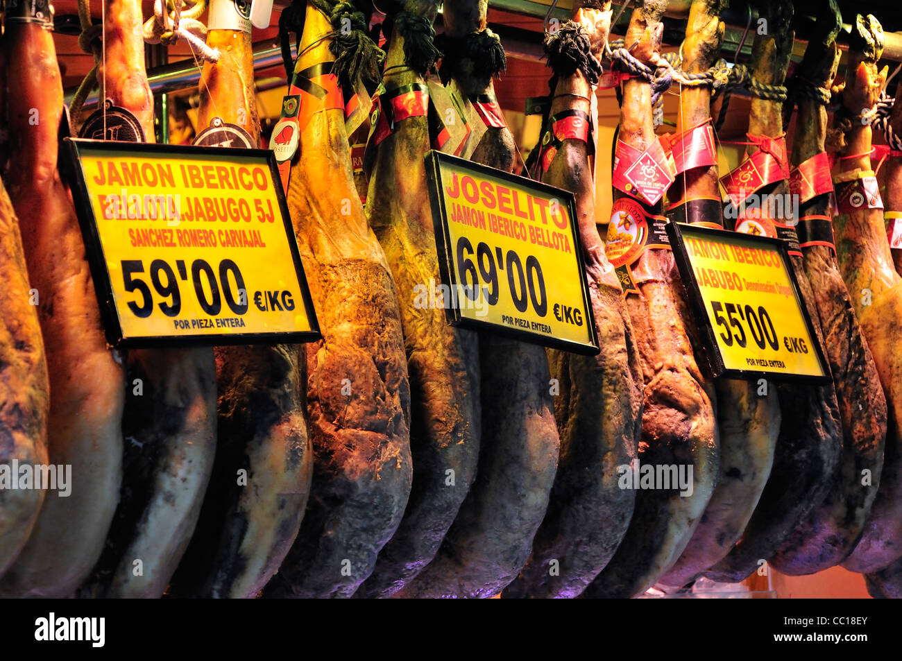 Barcelona, Spain. La Boqueria market. Hams / Jamon hanging up Stock Photo