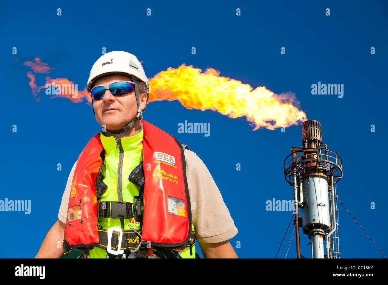 Flaring off gas at the Flotta oil terminal on the Island of Flotta in the Orkney's Scotland, UK. Stock Photo