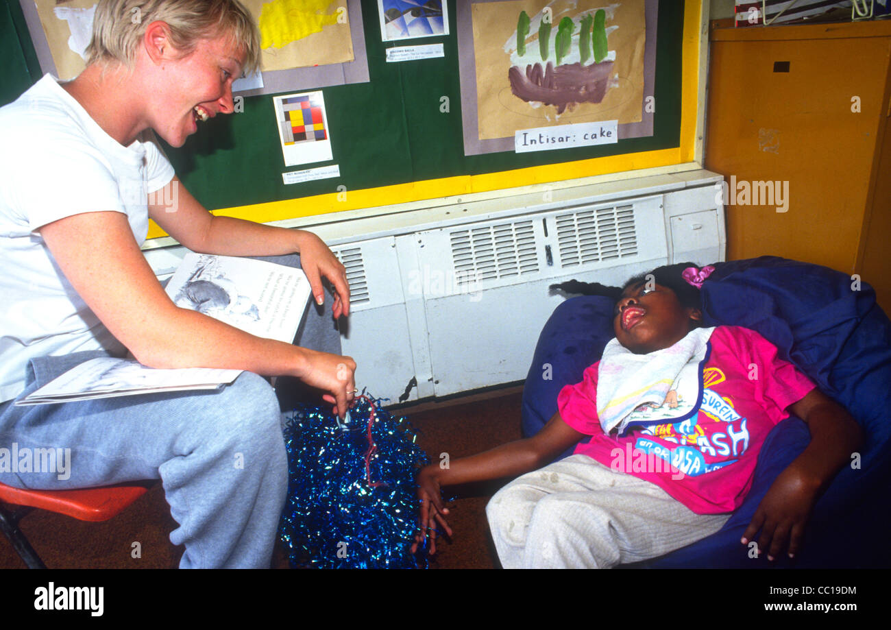 Teacher with pupil who has learning difficulties, London, UK. Stock Photo