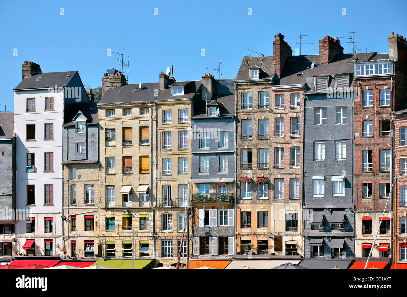 Typical facades on the port of Honfleur, commune in the Calvados department in northwestern France Stock Photo