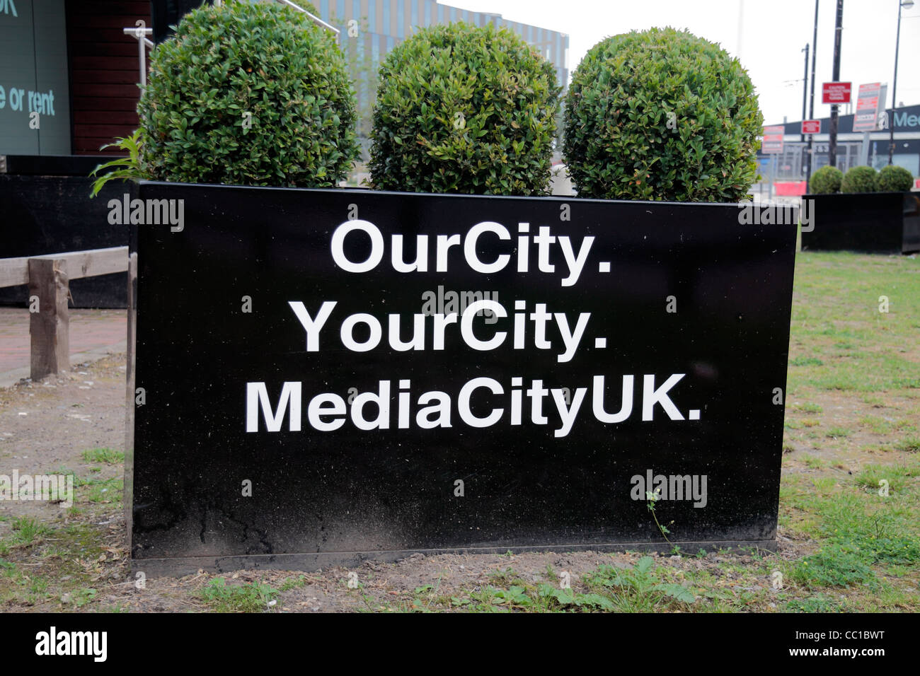 Sign for OurCity. YourCity. MediaCityUK at the tram stop beside the new BBC development in Salford, Manchester, UK. Stock Photo