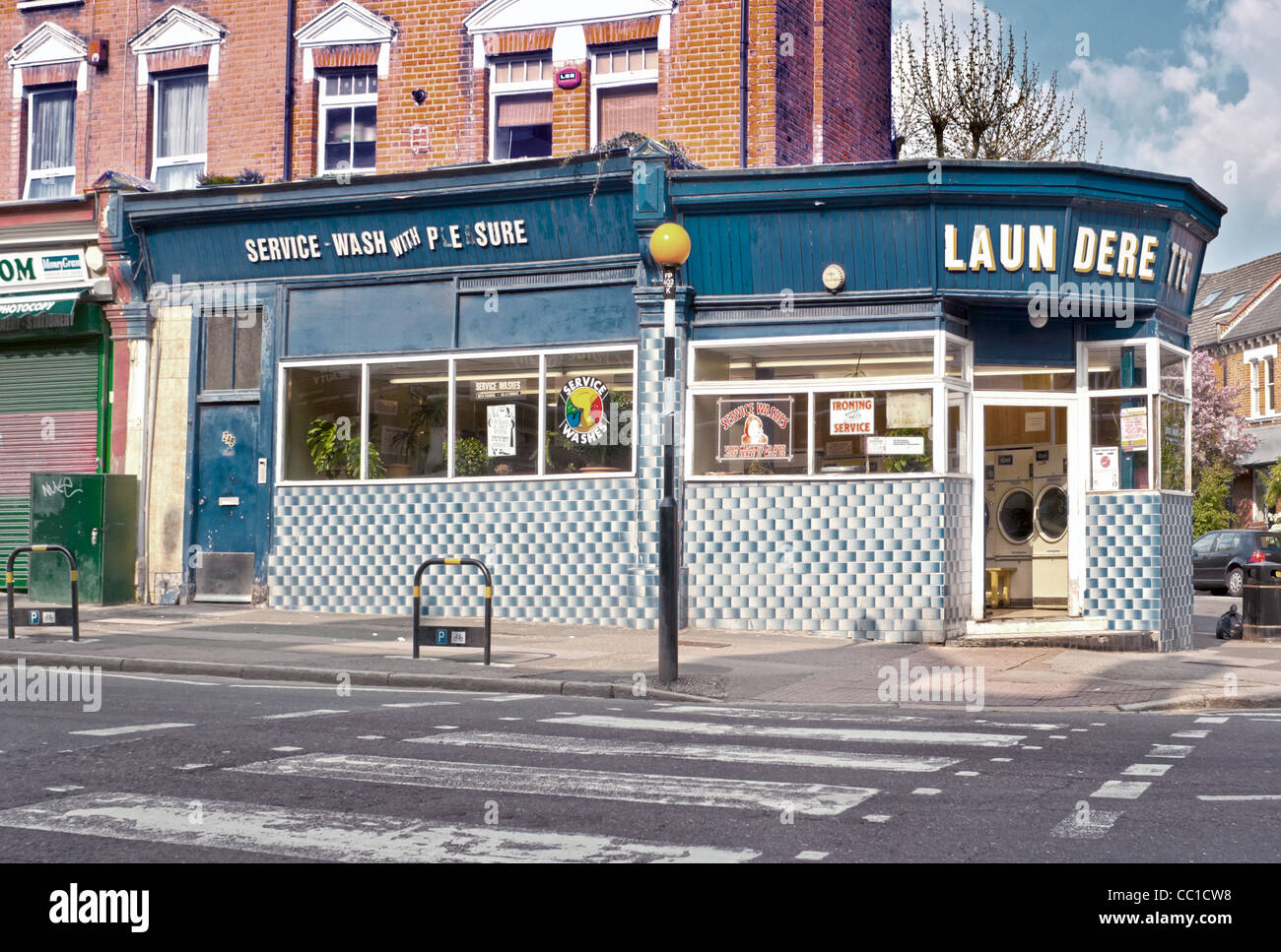 A busy launderette in Haringey North London Stock Photo