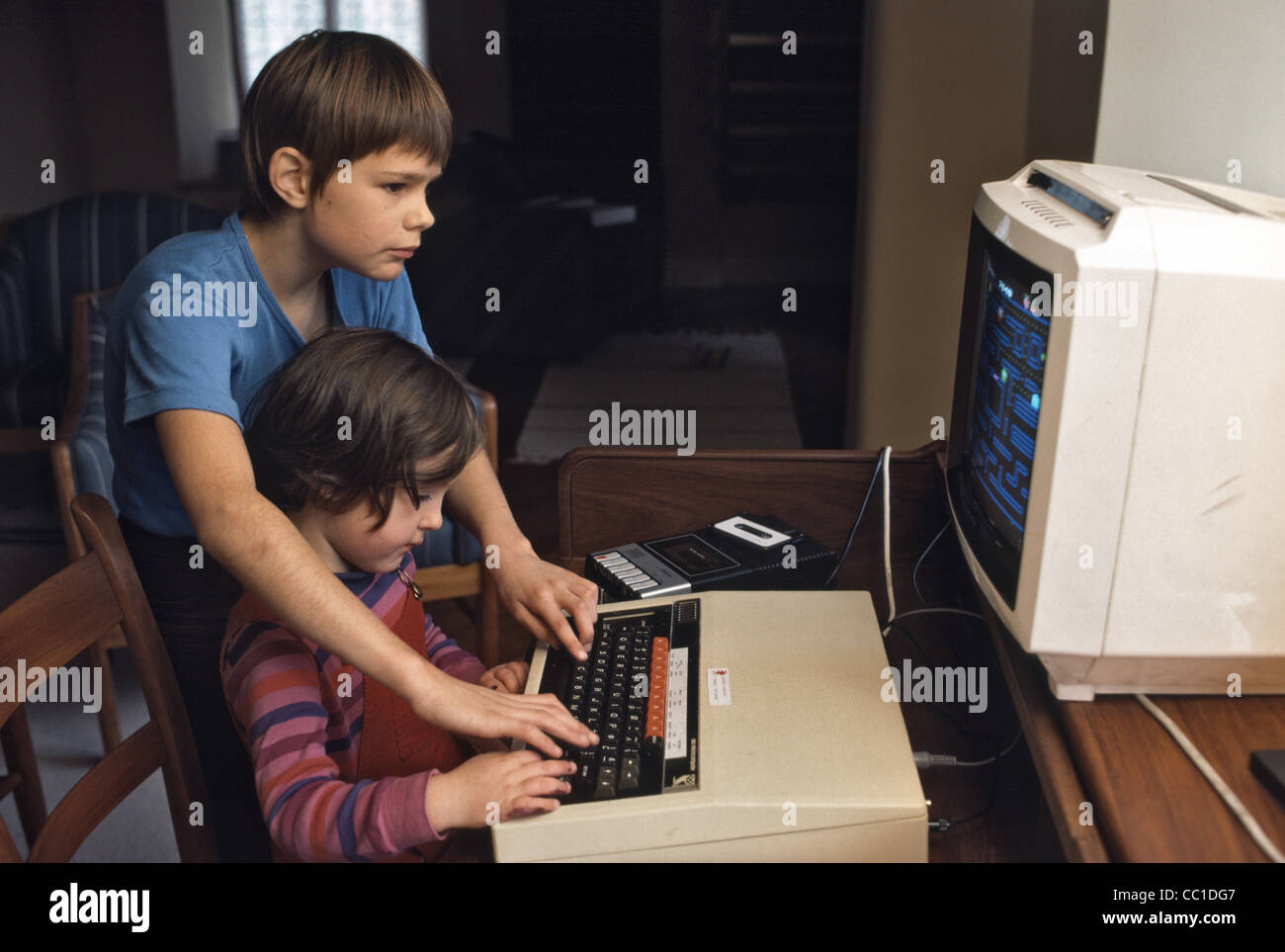 children playing on one of the first home computer called Archimedes Acorn Stock Photo