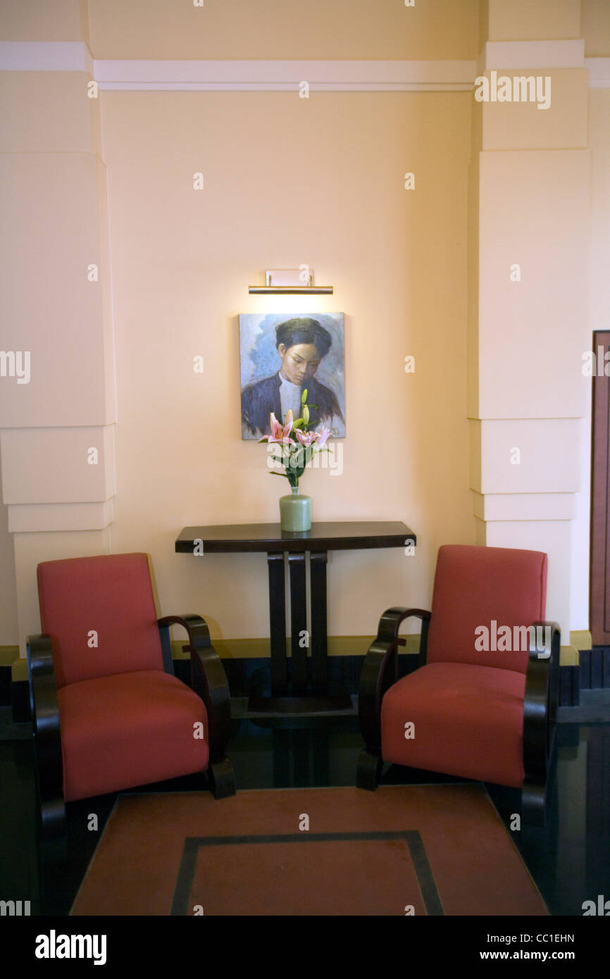 Art Deco furniture and a period painting in the lobby at La Residence Hotel, Hue, Vietnam Stock Photo